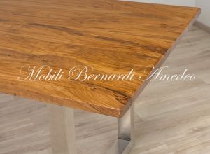 Modern style dining table with light olive wood top and stainless steel legs