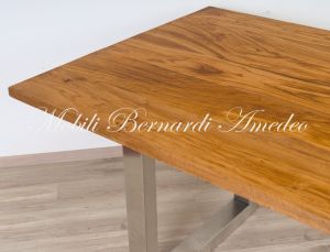 Modern style dining table with light olive wood top and stainless steel legs