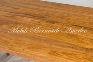 Modern style dining table with light olive wood top and stainless steel legs