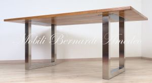 Modern style dining table with light olive wood top and stainless steel legs