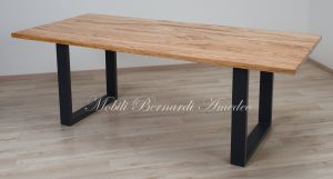 Modern table made with solid olive wood top finished in oil and dark-coloured iron legs