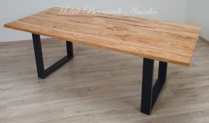 Modern table made with solid olive wood top finished in oil and dark-coloured iron legs