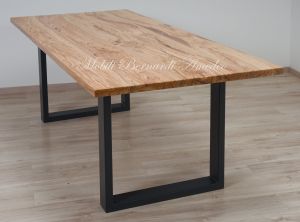 Modern table made with solid olive wood top finished in oil and dark-coloured iron legs
