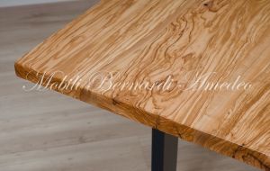 Modern table made with solid olive wood top finished in oil and dark-coloured iron legs