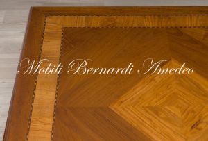 Large square coffee table - detail of the walnut top inlaid with olive wood