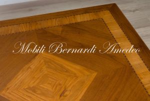 Large square coffee table - detail of the walnut top inlaid with olive wood