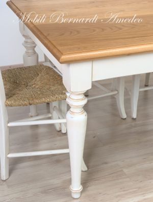 Dining table handcrafted in solid wood with light oak top and country style white turned legs