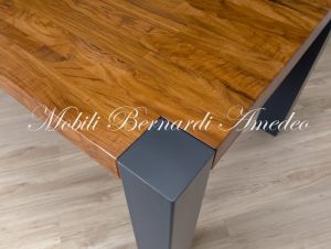 Modern table in solid olive wood and iron legs