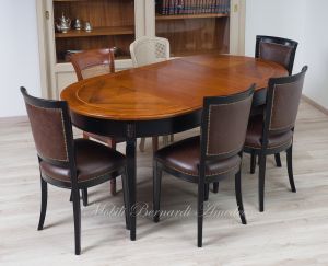 Tavolo rotondo stile classico finitura bicolore nero e noce con sedie classiche imbottite e rivestite in pelle